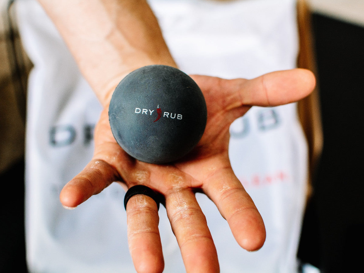 trigger point massage balls by Dry Rub - holding in hand